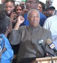 Charles Barron does a fist-pump to celebrate blowing off another pointless City Council meeting.